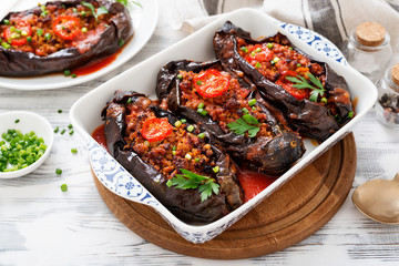 Karniyarik - Stuffed Eggplants, Aubergines with minced meat and vegetables baked with tomato sauce .
