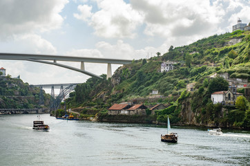 Ponte do Infante bridge in Porto Portugal. Old historic houses on a hill