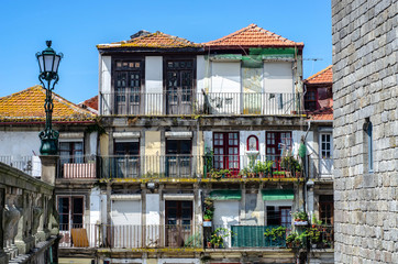 Fototapeta na wymiar Historic old city buildings facades and with clean laundry on balconies, Porto, Portugal
