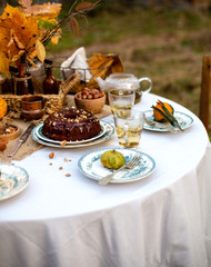 chocolate bundt cake with chocolate glaze on vintage plates on table with grey tablecloth