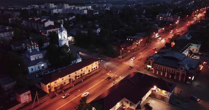 Night aerial view of Russian town of Pokrov with Cathedral of Intercession of Holy Virgin and busy M7 highway 