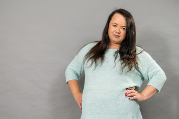 Plus size mature woman in jumper