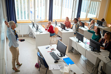 Teacher lecturer on class giving presentation young students on university .