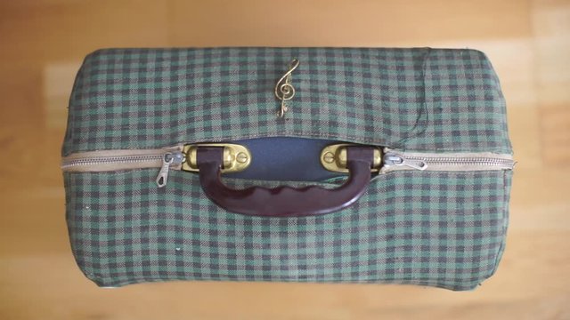 close-up old traveler musician bag
