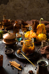homemade pumpkin spice mix in glass jar on rustic wooden table