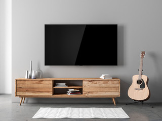 Smart Tv mockup hanging on the gray wall in modern interior with acoustic guitar