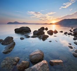 Fototapeta na wymiar Beautiful sunset on the sea shore.
