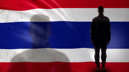 Thai soldier silhouette standing against national flag, proud army sergeant - obrazy, fototapety, plakaty