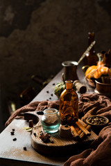homemade pumpkin spice mix in glass jar on rustic wooden table
