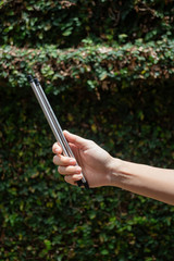 Hand on reusable collapsible drinking straw