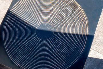 Black wooden board with circles for background.