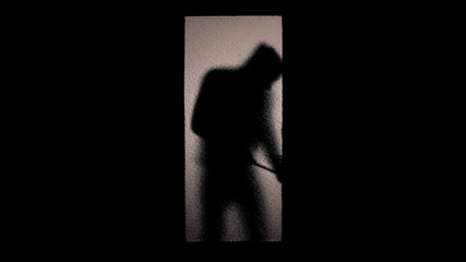 Silhouette of bandit cracking door lock, attack on private property, burglary