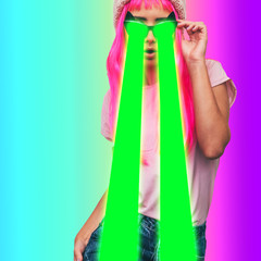 Alien girl with pink long hair shoots green lasers from sunglasses on gradient background.