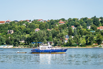 Obraz premium Novi Sad, Serbia - August 17. 2019: Sailboat on the water of the Danube River