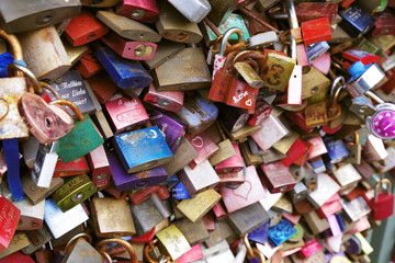 Colorful metal pad locks, symbol of eternal love.