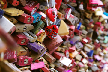 Fototapeta na wymiar Colorful metal pad locks, symbol of eternal love.