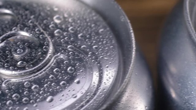 panoramic shot of aluminum cans with drops of clear water on the surface. View from the top. macro photography with Studio lighting.