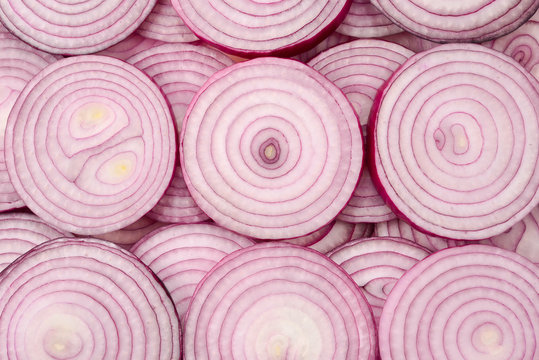 Onion slices as a background. Top view.