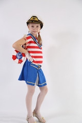 beautiful young girl in a sailor suit on a white background
