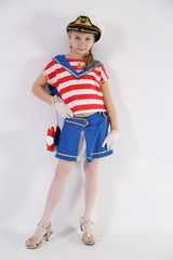 beautiful young girl in a sailor suit on a white background