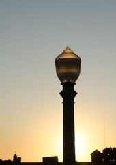 Street lights at sunset near Newport Beach pier