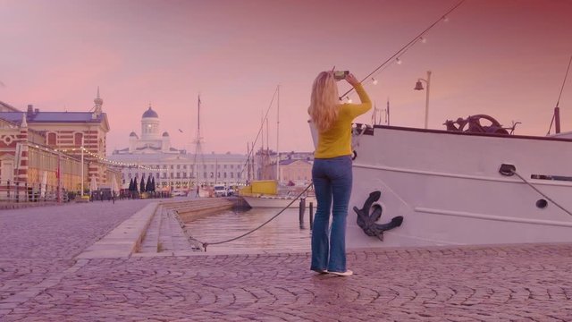 Travel Woman Taking Photos Using Smartphone In Helsinki