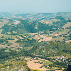 Fototapeta na wymiar Italian landscape of green mountains. Italian hills view from above. 