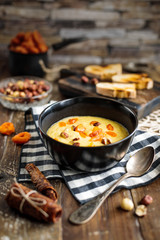 vegetarian breakfast of millet porridge with dried apricots