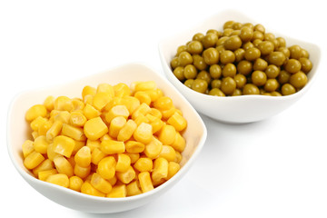 Canned Corn and Canned Green Peas. Isolated with clipping path.