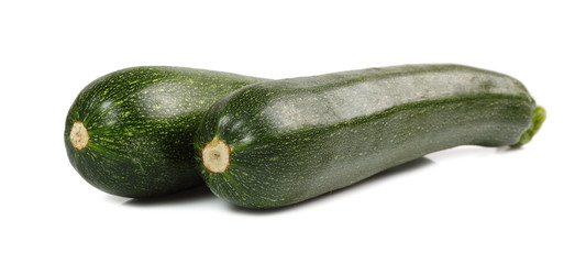 green zucchini on white background