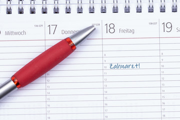 Kalender mit einem Eintrag Zahnarzt Termin
