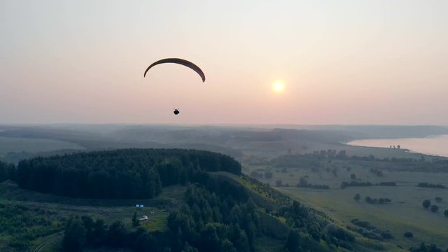 Parafoil is floating above the forests