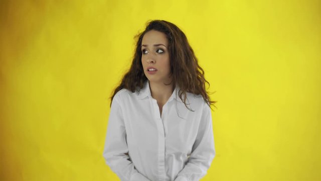 Young woman is worry and rubbing her hands