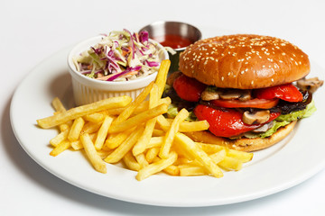 vegetarian burger with a potatoes and salad