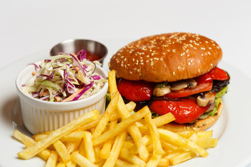 vegetarian burger with a potatoes and salad