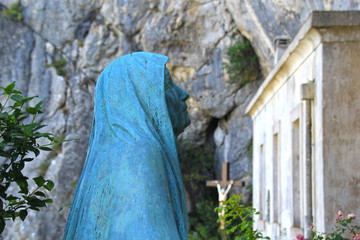 France, Sainte-Baume, august 23, 2019 : Statue of Mary Magdalene in front of the grotto entrance.