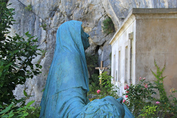 France, Sainte-Baume, august 23, 2019 : Statue of Mary Magdalene in front of the grotto entrance.