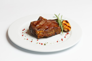 beef rib eye on a white plate