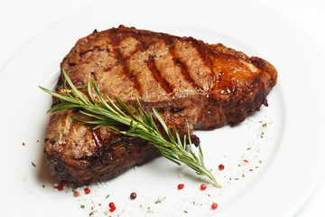 beef rib eye on a white plate