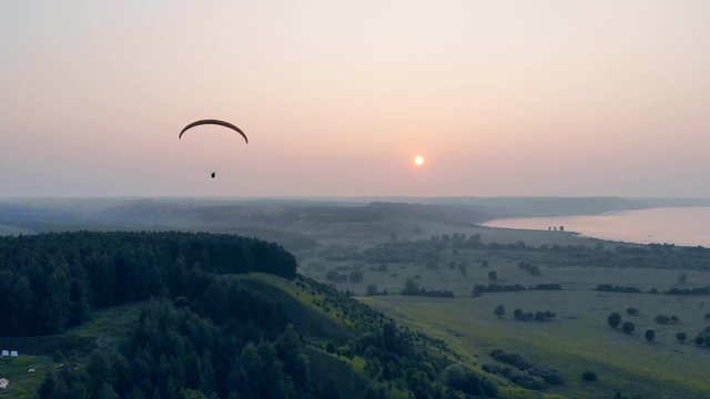 Sunset horizon with the paraplane floating across it