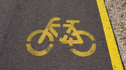 bicycle path with white sign in the park