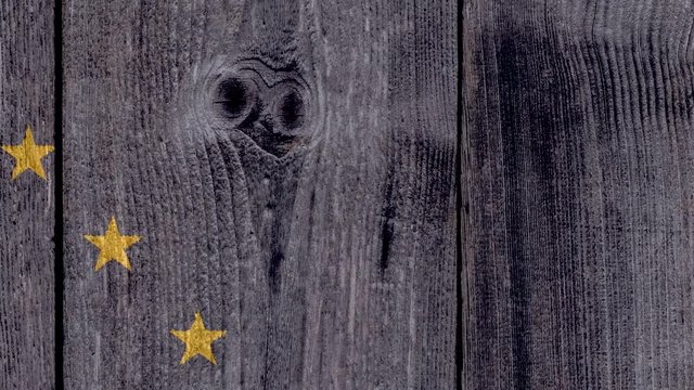 USA Politics News Concept: US State Alaska Flag Wooden Fence, Zoom Out