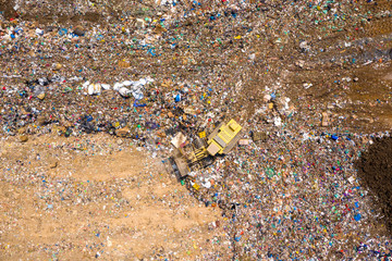 Top down aerial image of a Municipal Solid waste Landfill during collecting, sorting and pressing work
