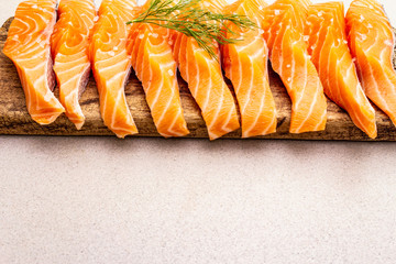 Slices of fresh salmon. Ingredient for cooking healthy seafood. Concept omega 3 containing food