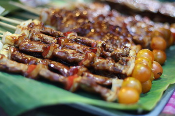 closeup​ BBQ.​ Sensitive Focus BBQ​ put​ on​ banana​ leaves.