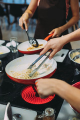 culinary master class for cooking pasta with mussels. close-up of hands
