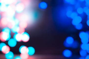 Beautiful  blurred bokeh background with blue and purple and red circles for holiday and Christmas...