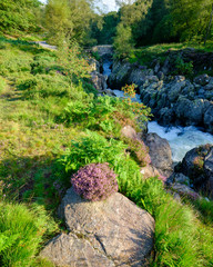 The old packhorse bridge known as Birk's Bridge across the river Duddon near Seathwaite in the Lake District National Park.