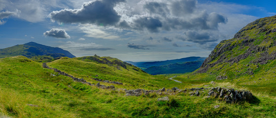 Views towards Eskdale from the summit of Hardknott Pass, Lake District, UK