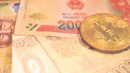 Close up the Vietnamese Dong Banknotes and Bitcoin